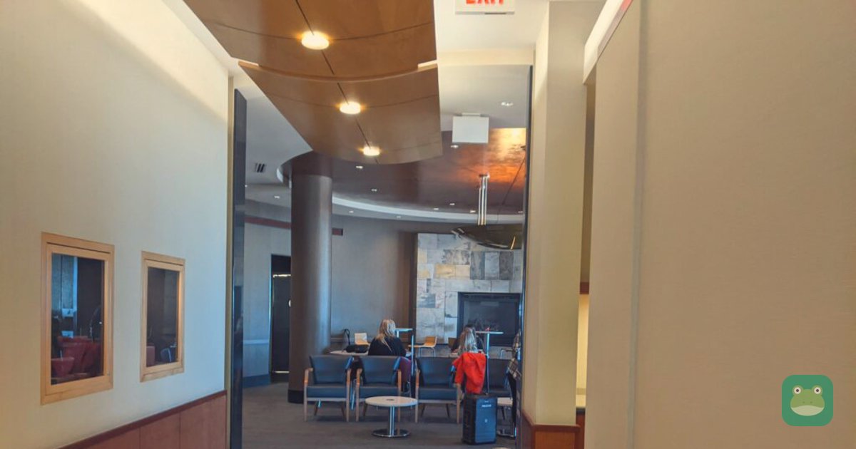 Delta Sky Club, MSP Concourse C — high-tops and fireplace seating