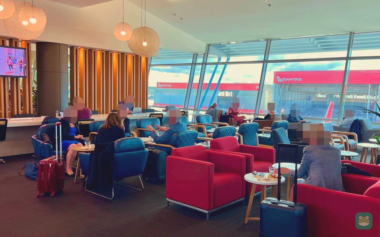 Qantas Domestic Business Lounge, SYD Terminal 3 — window seating overlooking the Qantas hangars