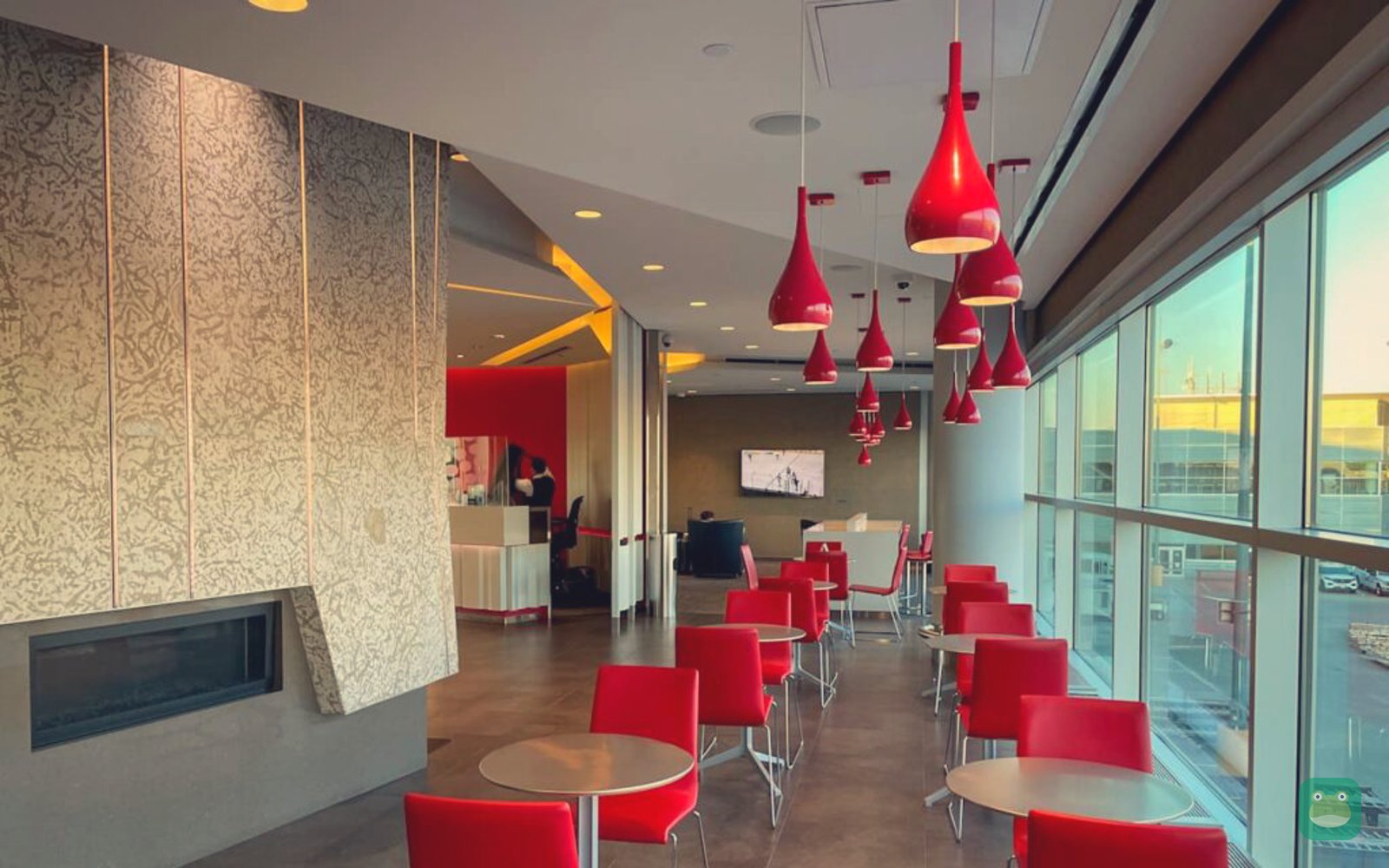 Air Canada Maple Leaf Lounge, YWG Main Terminal — red lounge chairs