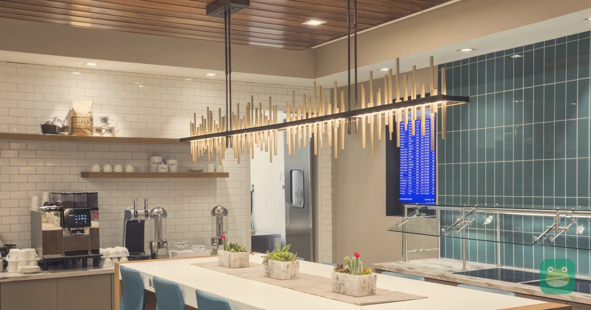 Food bar and seating at Escape Lounge CVG